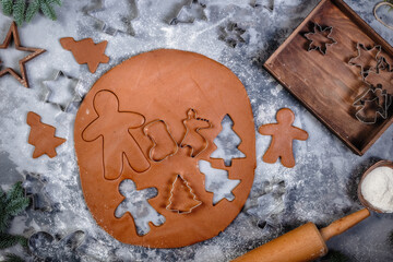 The process of making cookies and gingerbread at home. Rolled dough with carved Christmas pattern view from above
