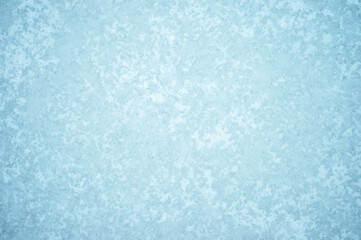 Natural ice ornament with a light frost pattern. Background