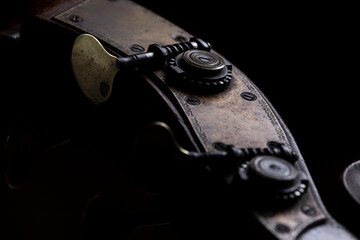 The tuning machine head with tuning keys or machine pegs of a acoustic wood double bass. A common...