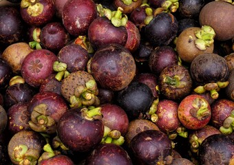 close-up of fresh ripe mangosteen fruits background