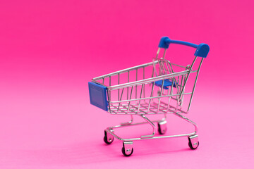 A Shopping Cart Isolated On pink background