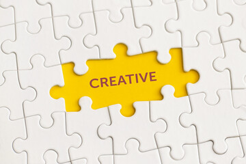 Fototapeta premium White details of puzzle with the text 