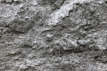 Naklejka premium Stone background. The texture of a stone wall. Close-up. Light gray stone background.