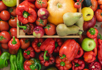 Background of peppers and fruits. Wooden box. Backdrops. Copy space.