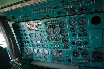 passenger airliner cabin. old, decommissioned Ukrainian plane. the plane is in the museum. cab with many buttons, toggles, controls and switches