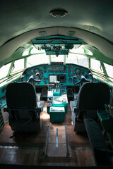 passenger airliner cabin. old, decommissioned Ukrainian plane. the plane is in the museum. cab with many buttons, toggles, controls and switches