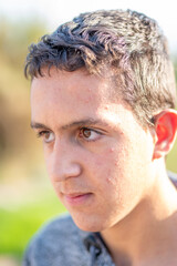 close up of latin guy teenage boy cheerful and smiling