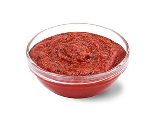 Ketchup in a sauce bowl on a white background