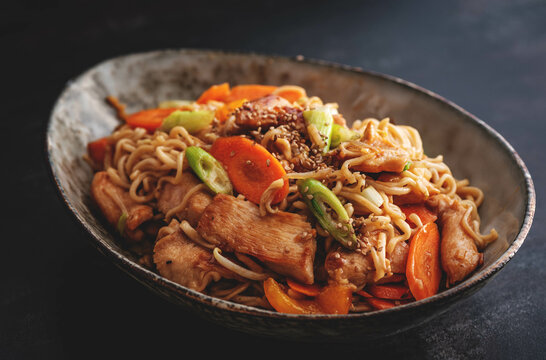 Fried Noodles with chicken and vegetable. Asia Wok food.