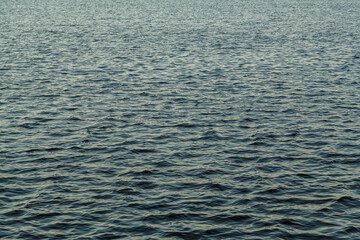 Water surface without waves on the river texture.