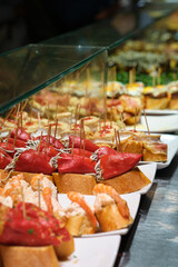 Naklejka premium Pintxos bar in San Sebastian, Basque Country, Spain