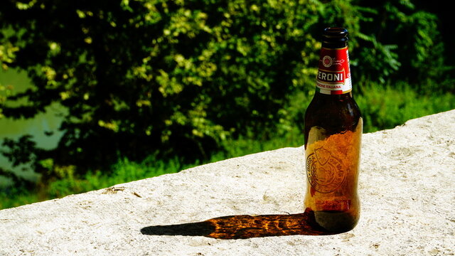 Rome, September 23, 2018: Empty bottle of Peroni beer with blurred background. Italian beer born in 1846 in Vigevano by Francesco Peroni