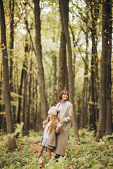 Fototapeta premium Mother with her daughter in park having fun