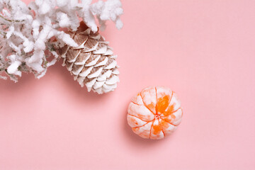 Top view Christmas and New Year decorations, pine cone, mandarin on a pink background. Flat lay Handmade New Year soap. Xmas toys. Holiday concept, gifts and homemade soap