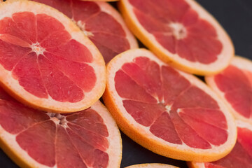 Sliced slices of red grapefruit.