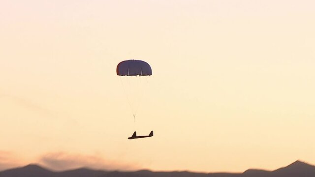 A military reconnaissance drone parachutes into 