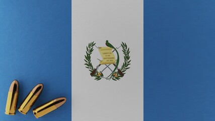 Three 9mm bullets in the bottom left corner on top of the national flag of Guatemala