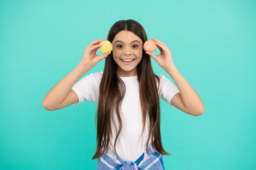 happy kid hold french macaron or macaroon cookies, happiness