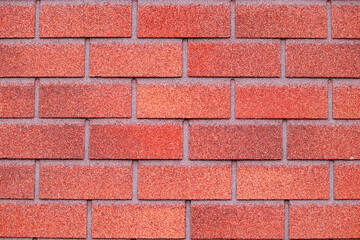 Obraz premium Brick wall background. Decorative coating of facade of building. Red brick texture.