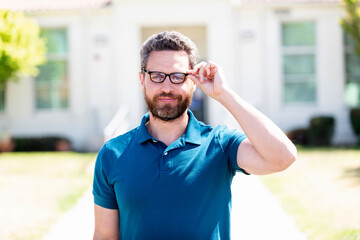 cheerful bearded man look through eyeglasses. vision acuity. eyesight. vision correction.