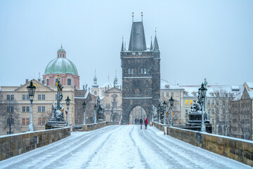 Fototapeta na wymiar Snow storm on Charles Bridge in Prague