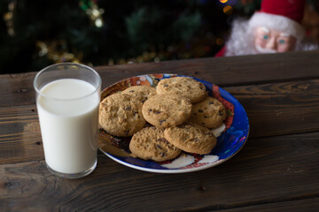 Father Christmas toy watching the cookies and the glass of milk.