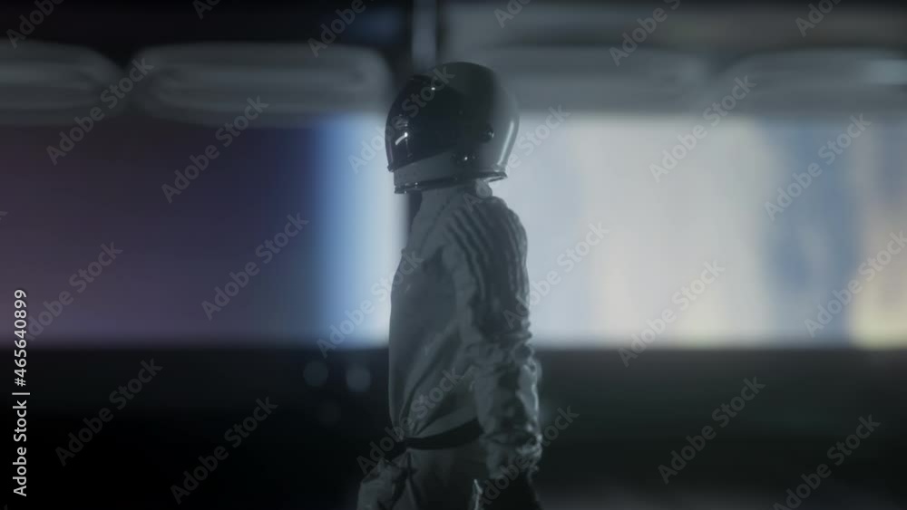 Wall mural astronaut going through the tunnel to another compartment of futuristic spaceship