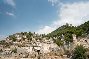 Fototapeta na wymiar Kayaköy Abandoned ghost town, stone houses and ruins. The site of the 18th century Ancient Greek city of Karmilissos. Fethiye – TURKEY