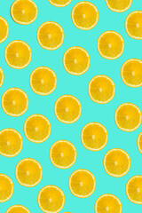 Orange slices pattern on the bright blue background, Summer food concept, Summer citrus background 
