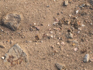 rocks and sand on ground road surface background