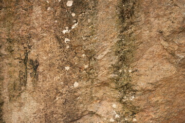 Old granite stone with smudges and lichens