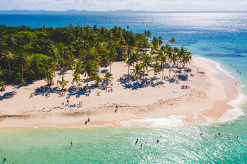 Sandy beach with turquoise water of coconut palms. Background from top view. Drone shot. Exotic travel tourism concept