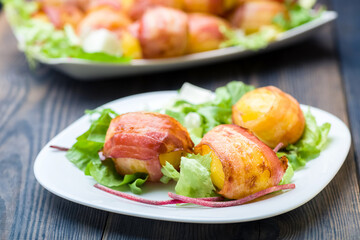 baked potatoes wrapped in bacon