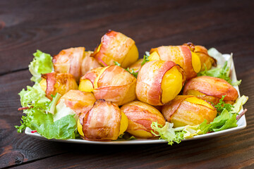 baked potatoes wrapped in bacon