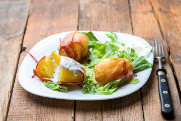 baked potatoes wrapped in bacon