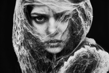 woman close-up in halloween costume spider web emotions