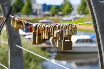 love locks on bridge in Estonia, Parnu. close up