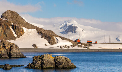 Antarctic landscape with mountains and argentinian Camara base station, Half Moon island, Antarctic...