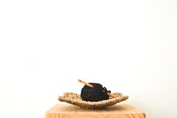 wool in basket with crochet needle