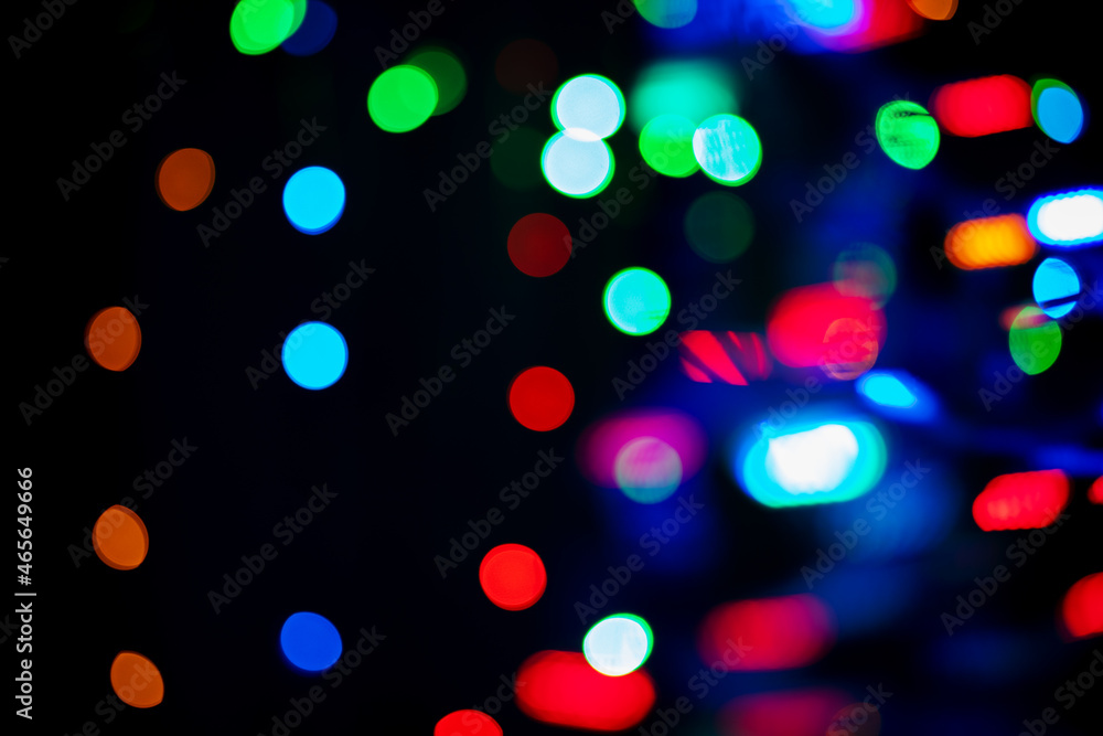 Poster black elegant background with multicolored bokeh. decorative defocusing effect. random composition