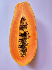 ripe papaya, cut in half papaya, seeds of ripe papaya, juicy orange fruit, natural vitamins, healthy fruit