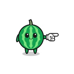 watermelon mascot with pointing right gesture