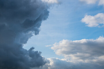 Fototapeta na wymiar Blue sky background with white dramatic clouds and sunlight, sky background