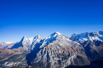 Fototapeta na wymiar Jungfrauregion, Schidhorn, its diversity makes the region unique. Lauterbrunnen is just as charming in summer as it is in winter. Hiking fans can enjoy the panorama on 300 kilometers amazing way