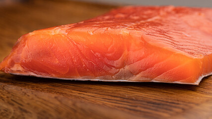 Trout fillet on a wooden background. Fresh fish. Trout.
