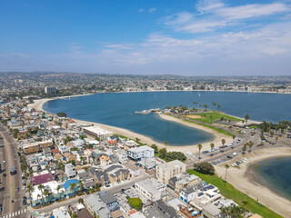Fototapeta na wymiar Aerial view of Mission Bay and beach in San Diego during summer, California. USA. Community built on a sandbar with villas, sea port and recreational Mission Bay Park.