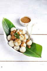 Cilok is West Java Indonesia traditional snack made from tapioca flour, served with peanuts sauce.