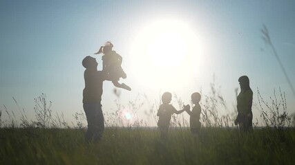 people in the park. happy family playing in the park silhouette. father throws up playing with daughter. happy family kid dream concept. friendly family in fun the park playing picnic - Powered by Adobe