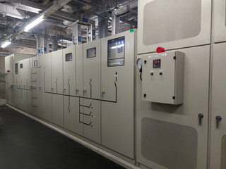 A lot of electrical cabinets located on enterprise substation