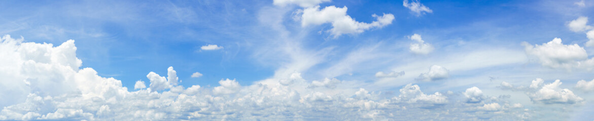 Naklejka na ściany i meble Panorama fluffy clouds against in blue sky